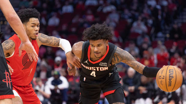 Rockets guard Jalen Green dribbles against Portland Trail Blazers guard Anfernee Simons (1) in the first quarter at Toyota Center.